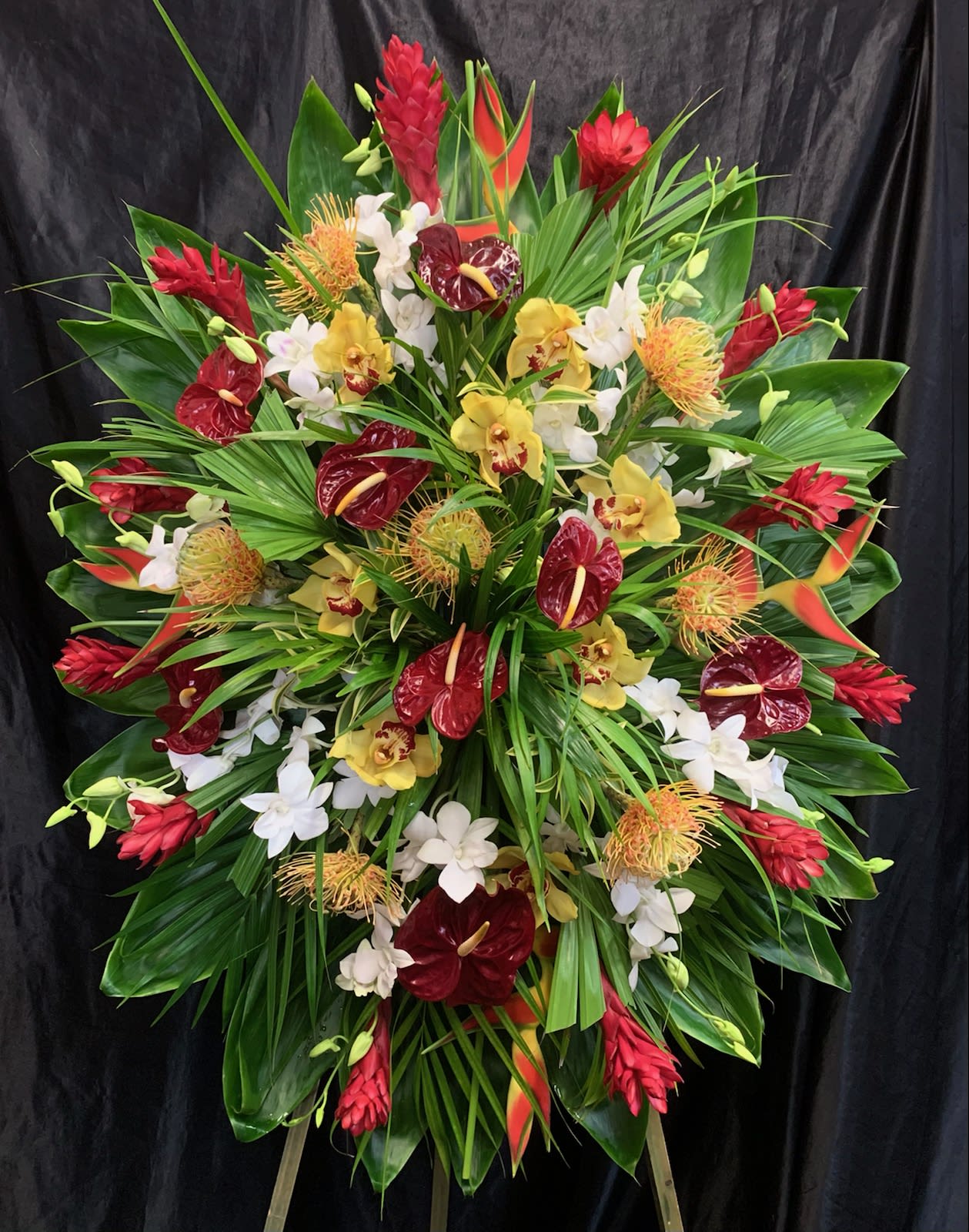 LARGE SIZED  3 1/2' X 4'  DELUXE STANDING SPRAY  L #1A - similar as shown: Red ginger, anthurium,  protea, cymbidium + dendrobium orchid, heleconia, foliage  