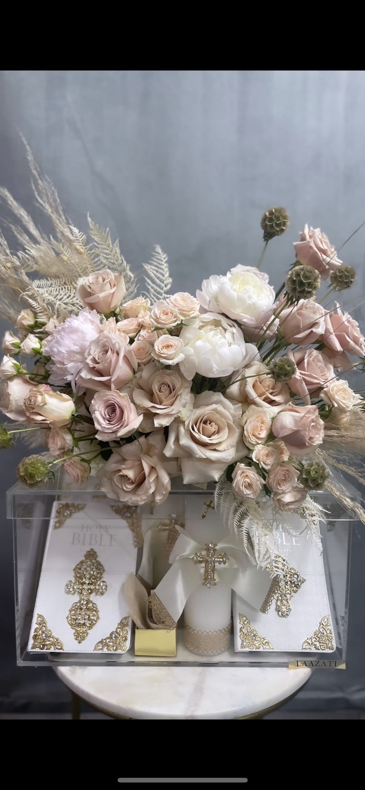 SINI SINI - PERFECT GIFT FOR NEW BORN BABY AND CRESTIONING .BIBLES AND CANDLES ARE NOT INCLUDING IN THE BASKET . IF YOU ARE INTERESTED TO GET THE BASKET WITH BIBLE AND THE CANLDLES PLEASE CONTACT US . SOME OF THE FLOWERS ARE SEASONAL .