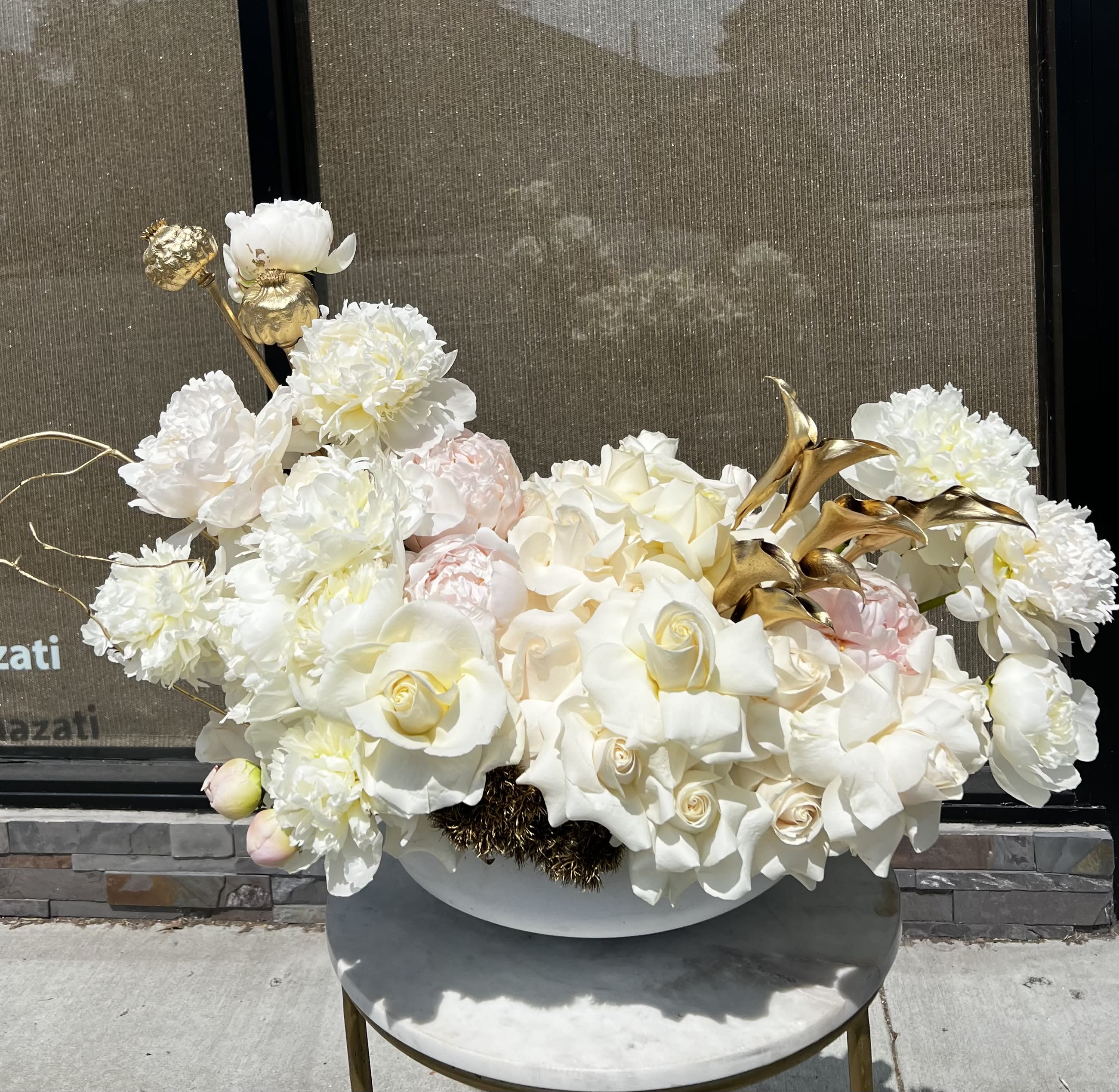 Romance  - Gorgeous white roses, peonies and cala lilies arranged nicely in a white ceramic container. Some of the flowers are seasonal . if not in season will be substitutions.  All sales are final once you received the flowers .  NO REFUND NO EXCHANGE 