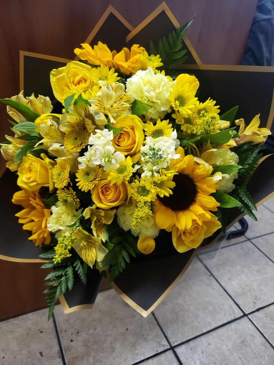 Be My Sunshine Bouquet - A fantastic way to show your love and care.  A mix of flowers yellow like sunflowers, daisies, astromelias, carnation, roses and solidago, stock witch some green   make this bouquet  gorgeous.  Has a nice yellow  bow.