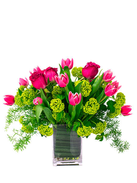 Graceful Tulips - Tulips and roses, a stunning combination. They are arranged in a clear and elegant vase.