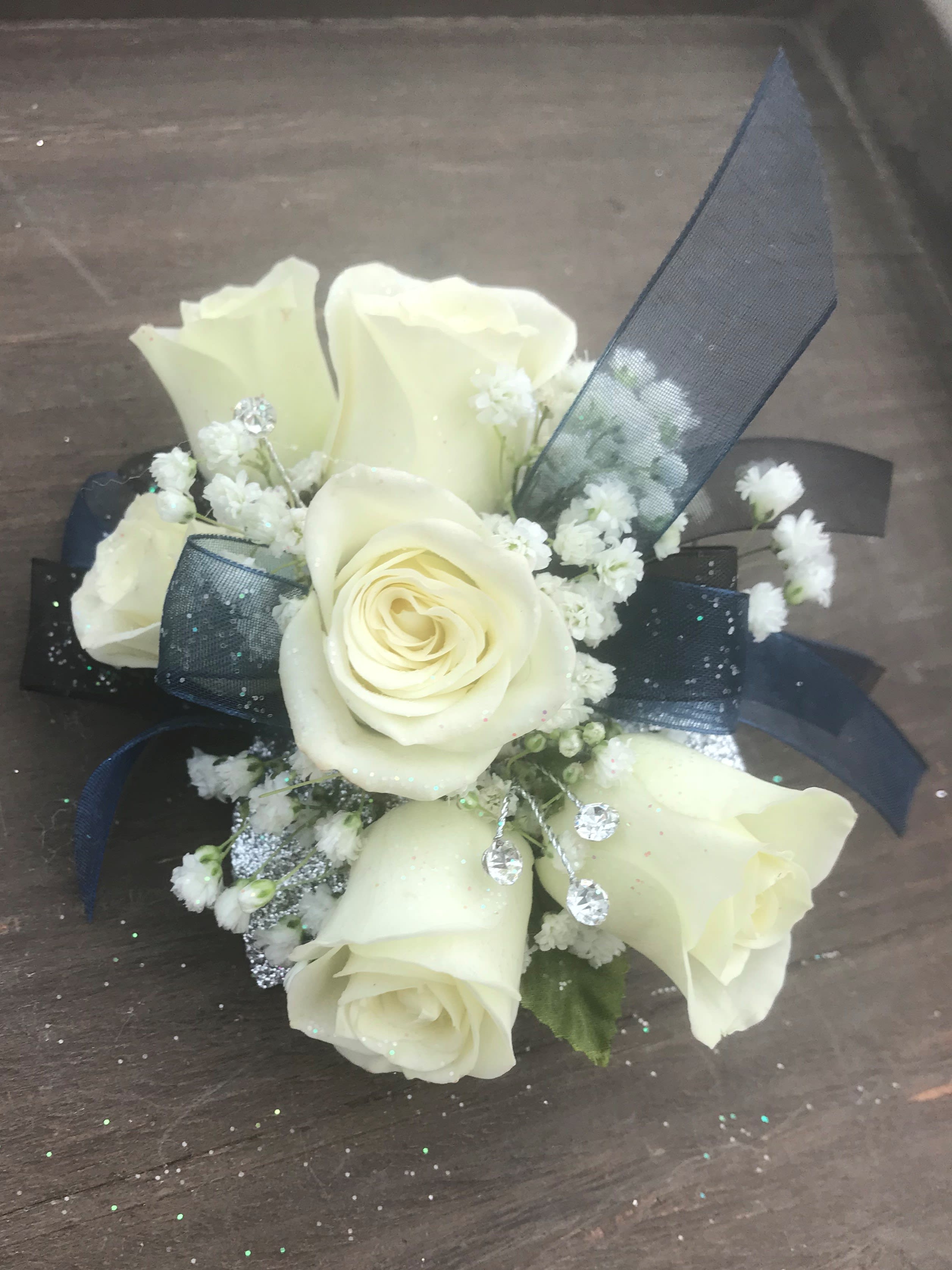 Jeweled White Spray Corsage - White Spray Roses, babies breath &amp; rhinestone spray with your choice of ribbon accent color designed on a wrist band. 