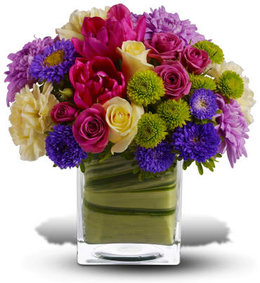 One Fine Day -  Oh, what a fine day it will be when you have this delightful spring bouquet delivered to someone special. Everyone will delight in the vibrant colors and bountiful blossoms, all thoughtfully arranged in a beautiful leaf-lined vase. Light yellow roses, hot pink spray roses, tulips and gerberas, yellow carnations, green button spray chrysanthemums and lavender cushion spray chrysanthemums are delivered in an exclusive cube vase. You'll have many fine days when you send this beautiful bouquet!    Item # T147-2A 