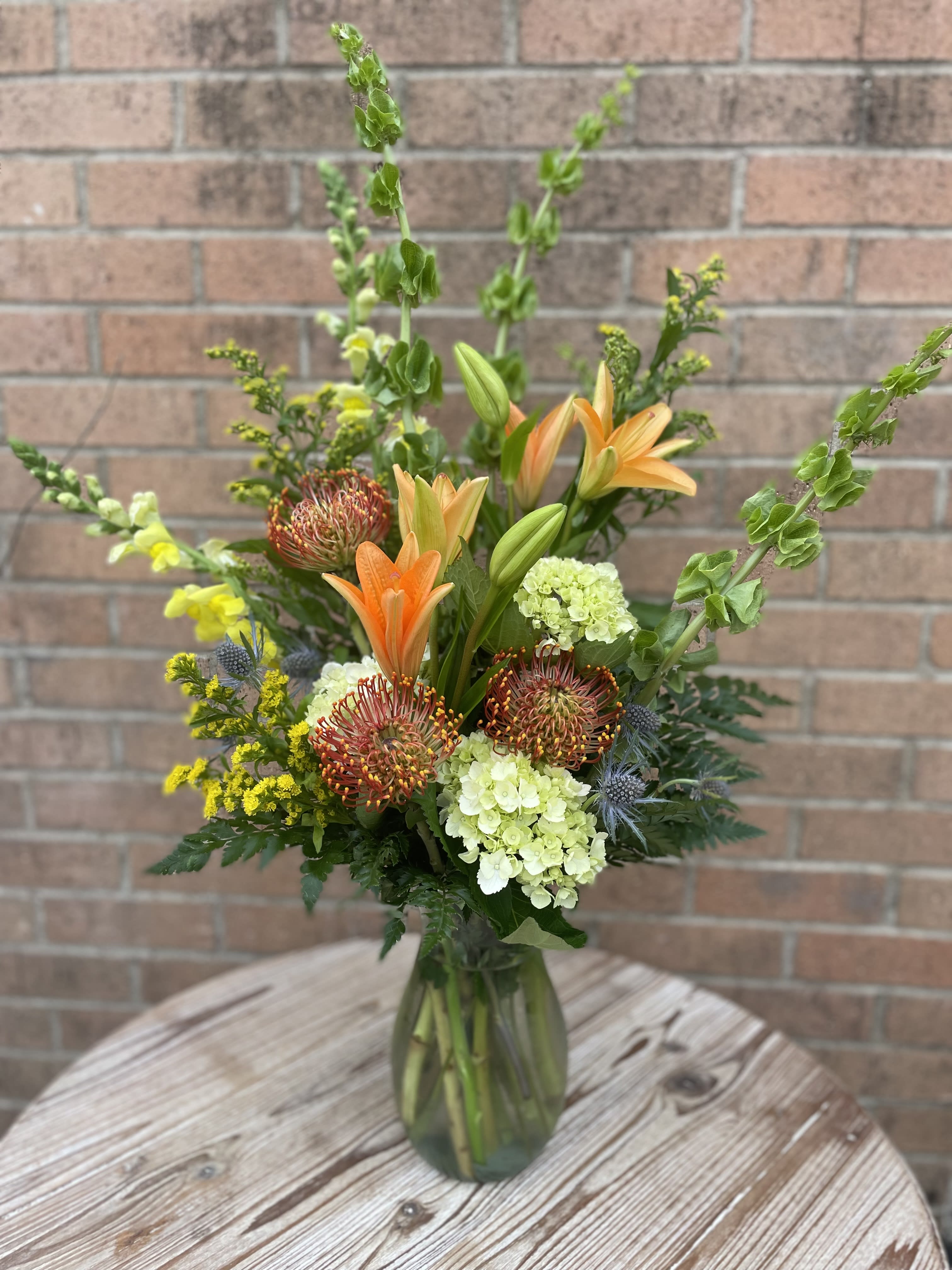 Majestic Sunrise - Imagine you're in a field enjoying a breathtaking sunrise. This bouquet will evoke those images for the recipient as they enjoy the bright colors of this striking arrangement.