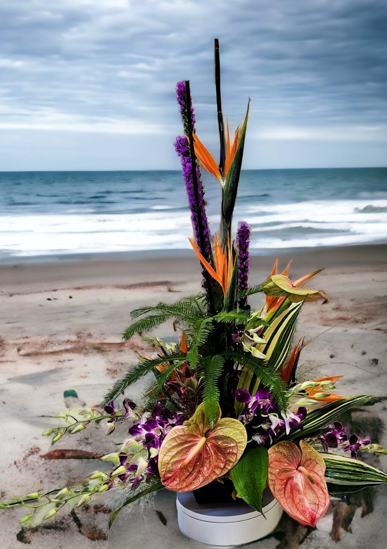Tropical Paradise - Take a trip to paradise with a tropical floral arrangement! The flowers will vary based on availability.....our designers choose the freshest and most beautiful tropical flowers on the day of your order. 