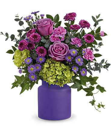 Amethyst Awe - This awe-inspiring mix of roses and hydrangea is sure to take their breath away! Something that will sure to brighten anyone's day. It's perfectly complemented by an amethyst, frosted purple glass jar. 16 1/2&quot;W x 16&quot;H *Flowers will be in purple, lavender and green, as close to the photo as possible with the flowers that are available and in season. 
