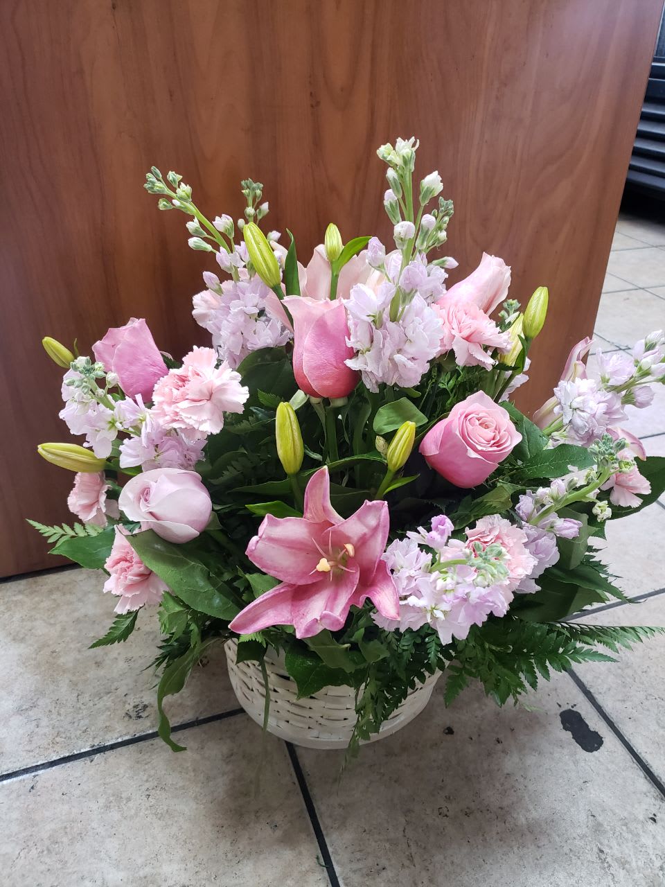 Pink Inspiration - Express your love with this incredible combination of pink in the same flower arrangement, it has 6 pink roses, 3 pink Asian lilies, 6 light pink stock, 7 pale pink carnations, salad tips, fern leaves, all these pretty flowers in a white basket