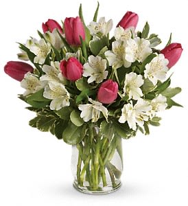 Spring Romance Bouquet - Romance buds in the spring - and it blooms beautifully in this charming bouquet of tulips and alstroemeria. Presented in an elegant hurricane vase, it's a heartfelt gesture she'll remember through all seasons.  Includes pink tulips, white alstroemeria and variegated pittosporum. Delivered in a glass hurricane vase.  Approximately 13 1/2&quot; W x 14 1/2&quot; H  Orientation: All-Around