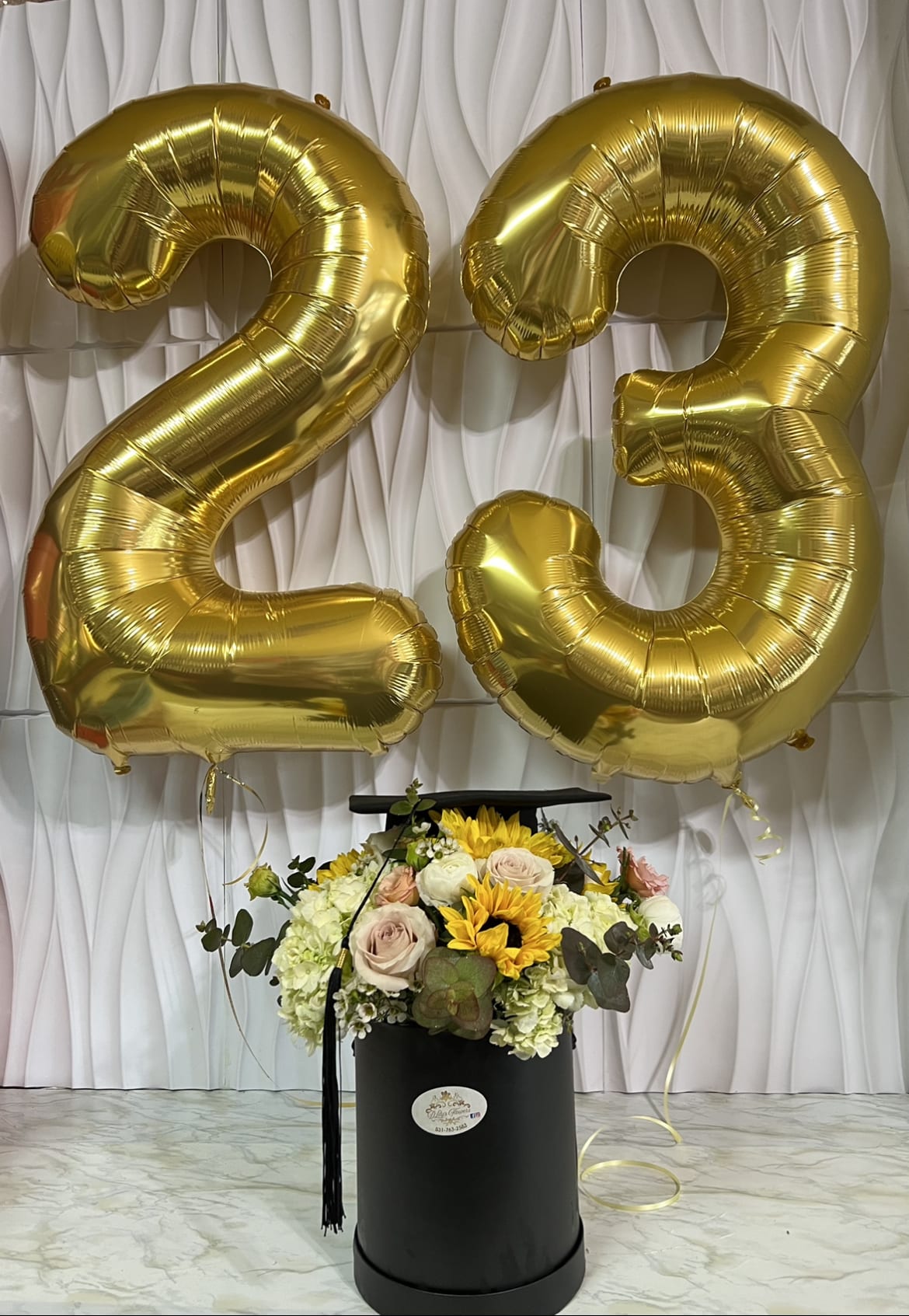Congratulations  - This beautiful mix flower arranged in a grad box paired with number balloons to congratulate a special graduate. 