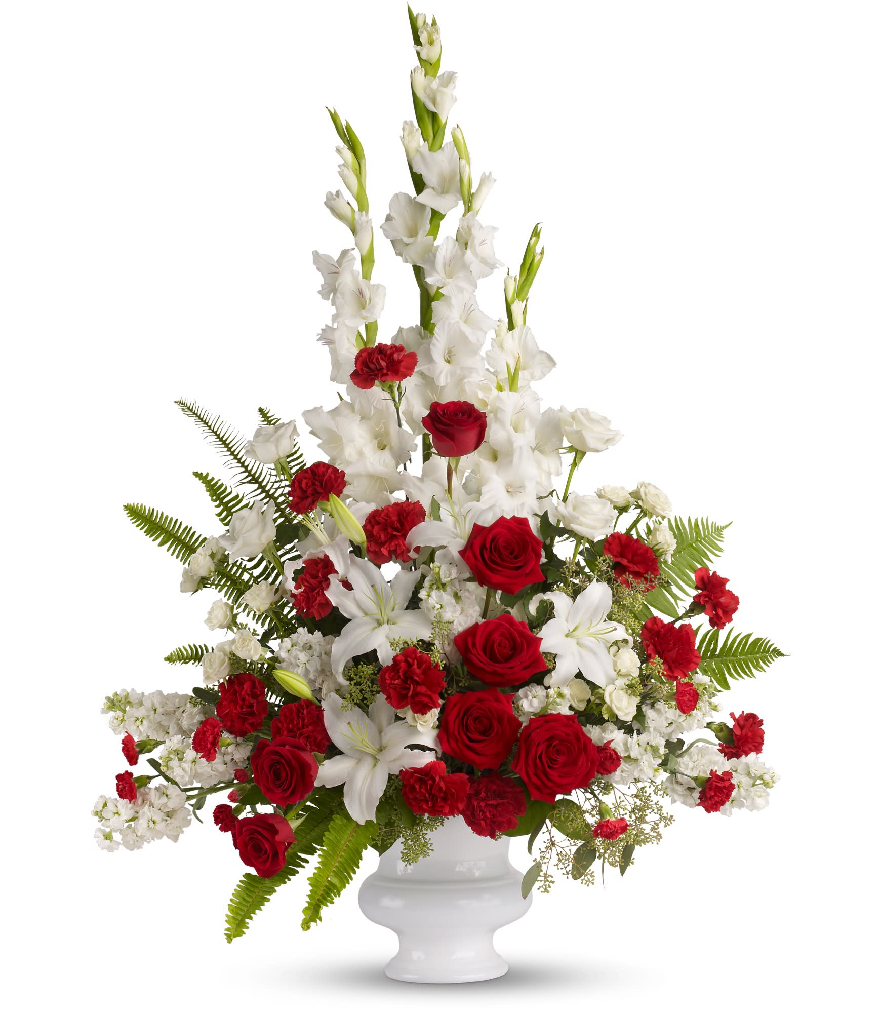 Memories to Treasure - For the sweet spirits who touch our lives, a classic pairing of red and white that is both vibrant and respectful. Beautifully contained in a white urn.  PLEASE NOTE: Florist reserves the right to make modifications to the design based on seasonality and accessibility of blooms and vases. Any modifications made will honor the palette, intent, and feeling of the pictured design. Contact floral designer directly with any specifications or concerns.