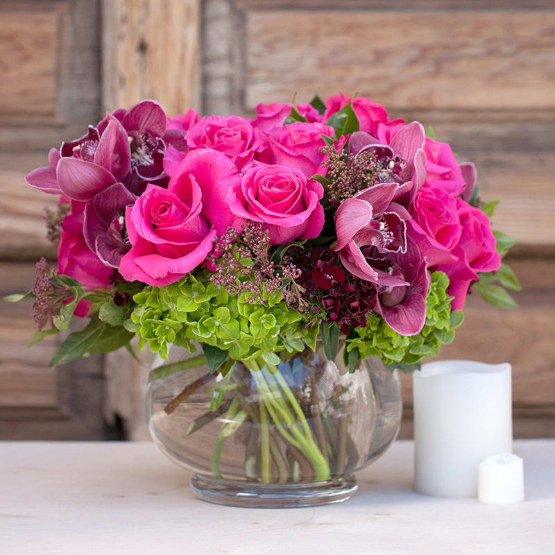 Vivid Dream - Vivid pink roses and orchids in a glass bowl, simple yet elegant and romantic.