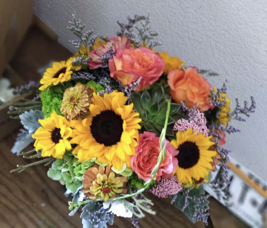 Surprise! Sunflowers! Surprise! Sunflowers! - Circus roses, hydrangeas, and sunflowers.
