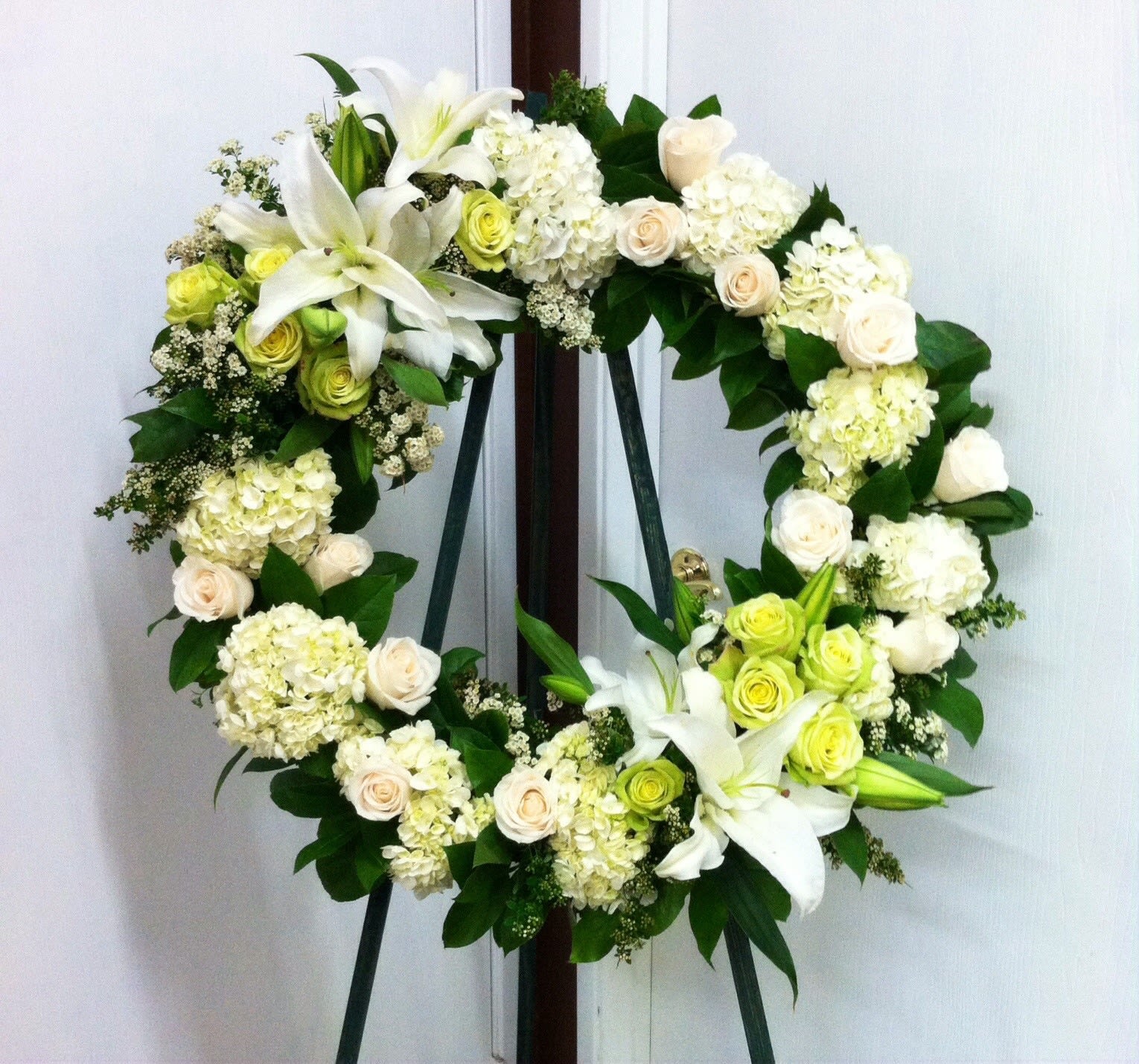 All White Wreath  - All white funeral wreath with white hydrangea, lilies, roses and greens. 