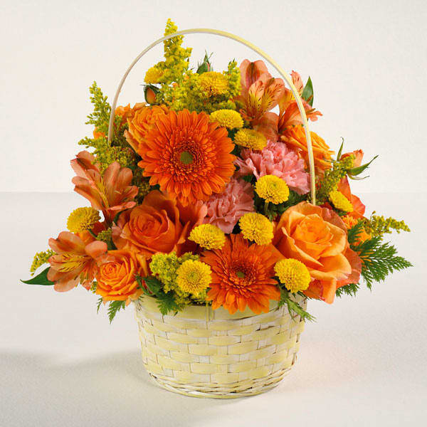 Sunshine Surprise - Everyone's emotions will rise and shine with this bright, delightful basket of roses, alstroemeria, pompons and more!