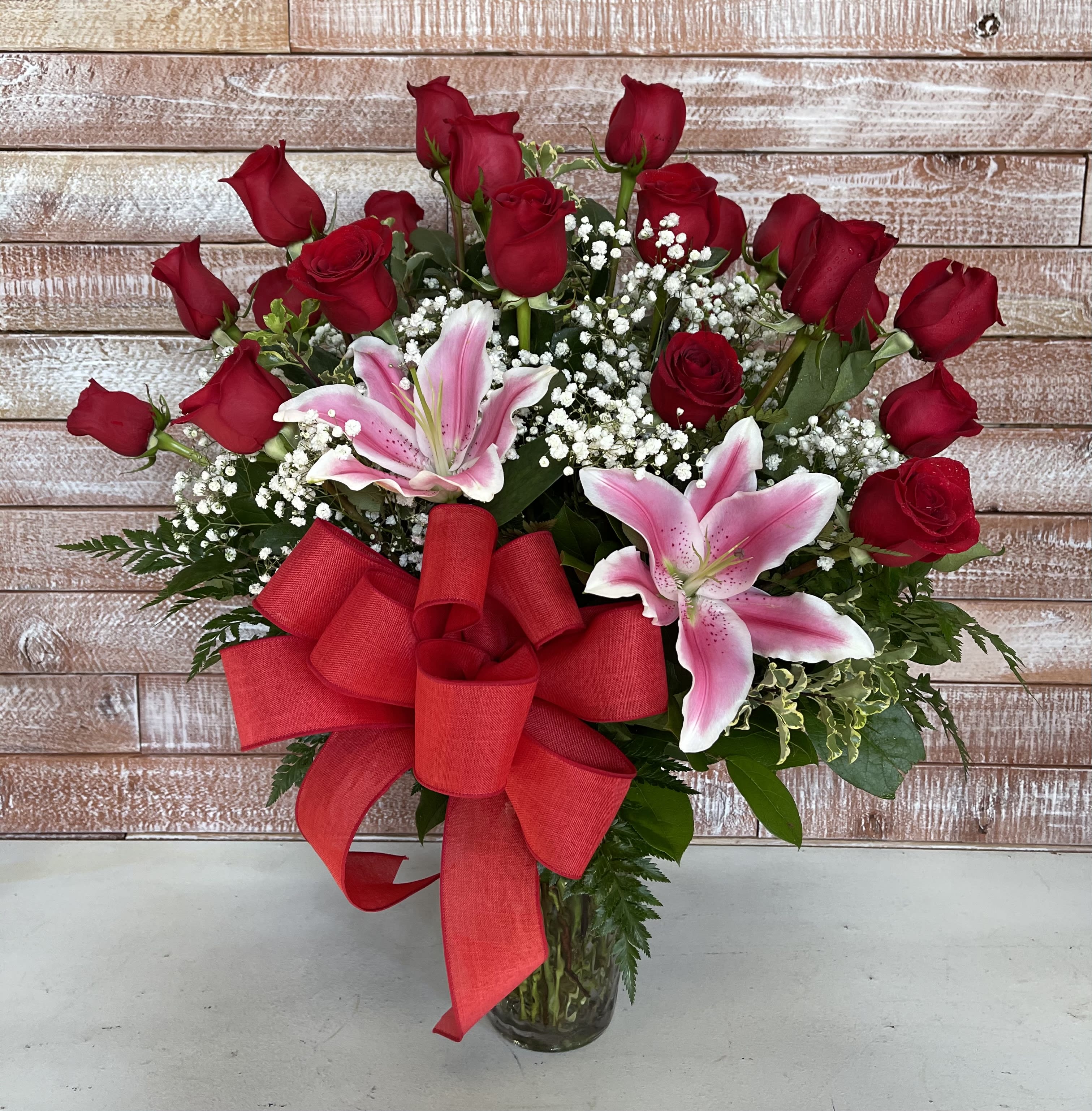 2 Dozen Vase  - 2 dozen of beautiful red roses with the babys breath to accent it. A grand arrangement that will sure to make a statement. Send the one you love a big statement of love. 