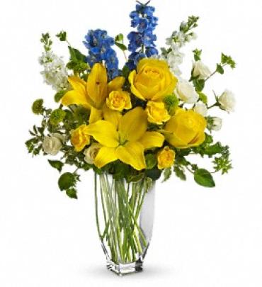 Meet me in Provence Meet me in Provence - With a beauty reminiscent of the south of France, this proud and pretty arrangement holds nothing back. The colors, the flowers and the feeling of Provence are all present and accounted for in this wonderful bouquet. Yellow roses, spray roses and asiatic lilies, white spray roses and stock and the ever-delightful light blue delphinium are delivered in a Jewel Vase. C'est magnifique! Item # T58-1A