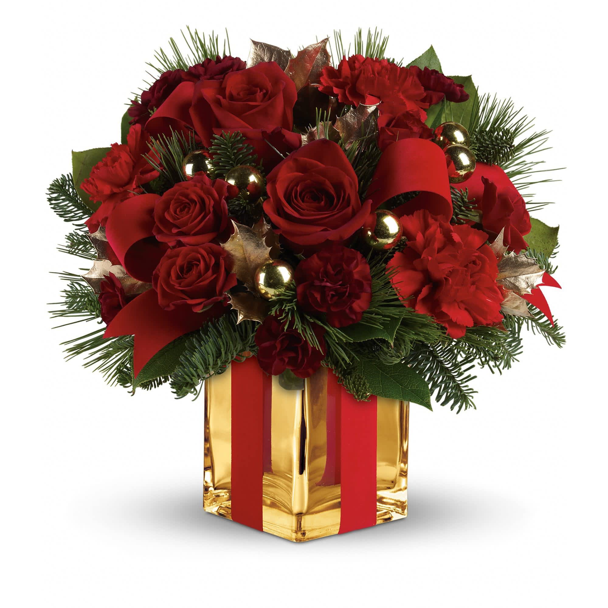 All Wrapped Up Bouquet by Teleflora - Lush red roses, fresh winter greens and a festive, gold mirrored glass cube are all wrapped up with red ribbon for an elegant, unforgettable gift!    This bouquet of deep red roses and spray roses, red carnations, maroon miniature carnations, green holly, noble fir, white pine and lemon leaf is dressed up with red velveteen ribbon and gold ornament balls. Delivered in a stunning gold Mirrored Cube vase.    Approximately 12 1/4&quot; W x 11 3/4&quot; H    Orientation: One-Sided    As Shown : TWR08-2A  Deluxe : TWR08-2B  Premium : TWR08-2C
