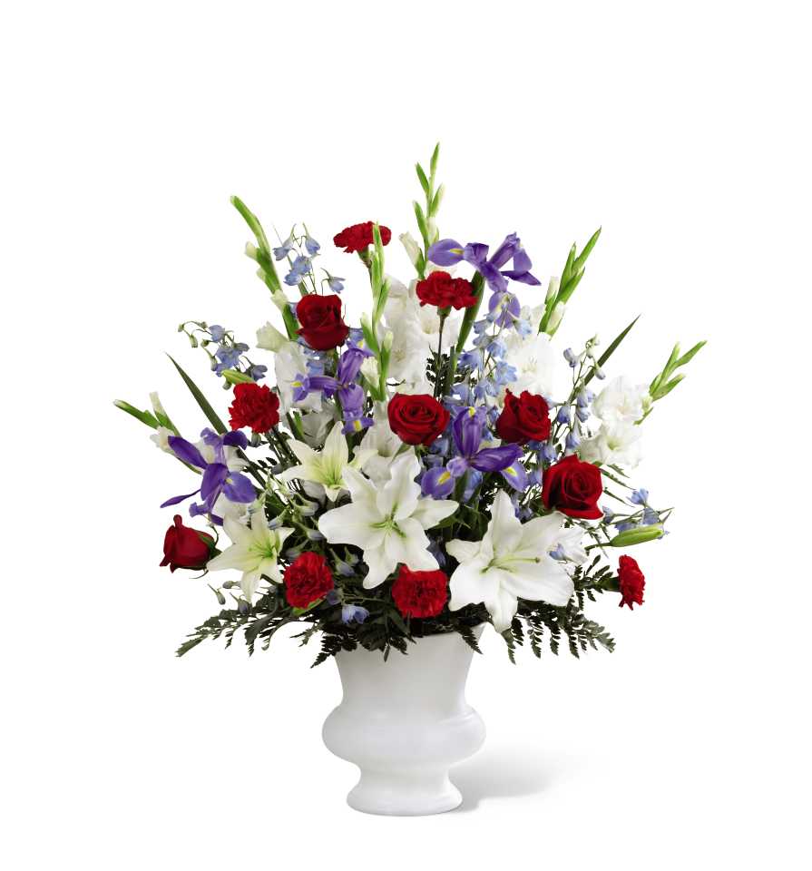 The FTD Cherished Farewell Arrangement S45-4544 - The FTD Cherished Farewell Arrangement is an elegant display of patriotic beauty to honor your loved one at their final farewell service. Red roses, red carnations, white gladiolus, light blue delphinium, blue iris, white Oriental lilies, white Asiatic lilies and lush greens are elegantly arranged in a white plastic urn to create a stunning way to say your last goodbye.