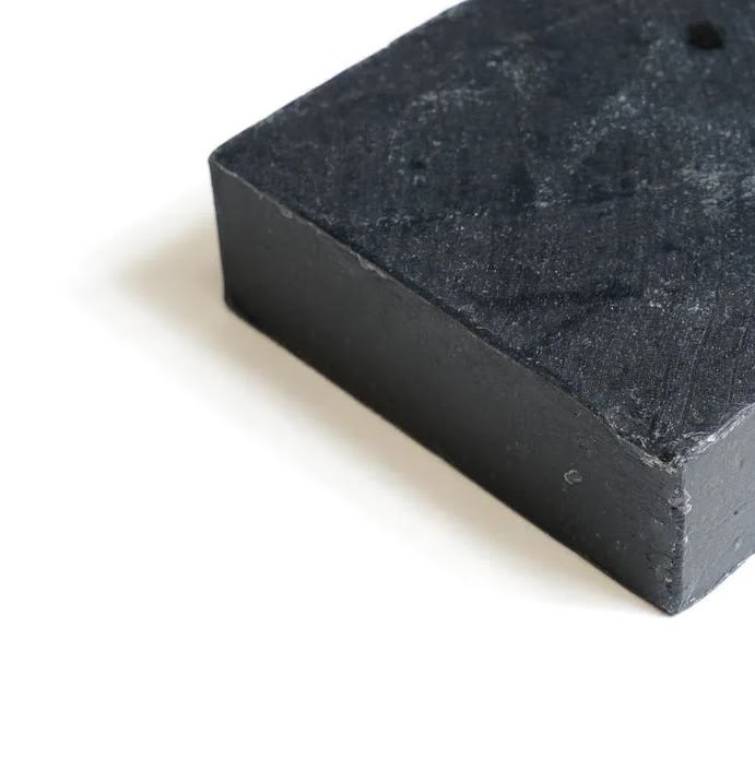 Soap Cherie: Charcoal Bar - Handmade facial/body cleansing bar curated from a blend of botanical oils and Activated Charcoal to remove impurities and dirt from deep within the pores and purifying the skin. Recommended to use on oily skin and acne prone skin.