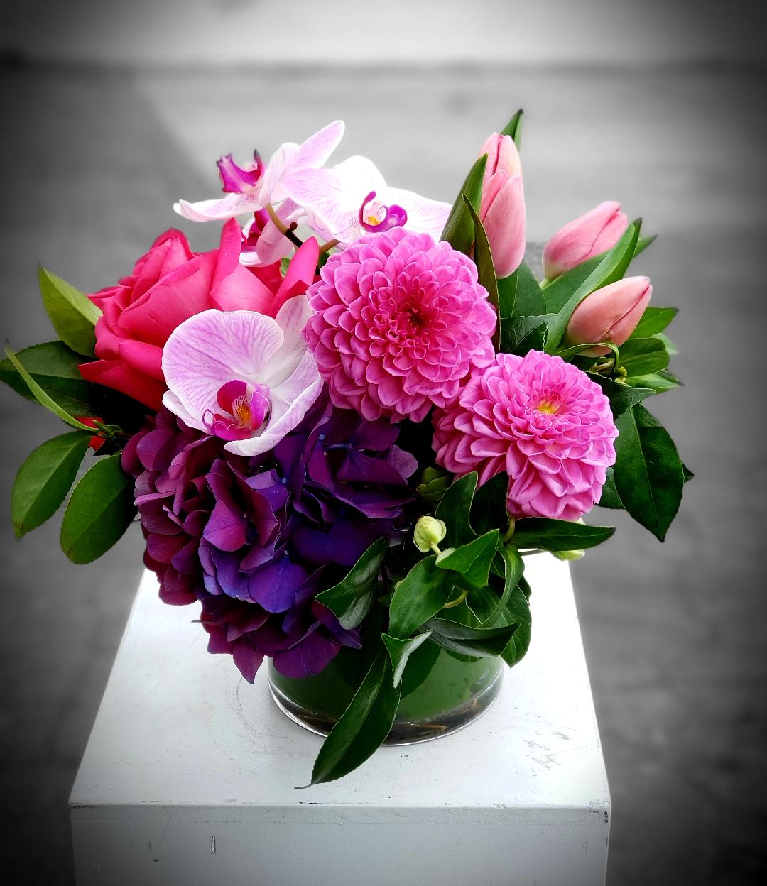 Summer at griffith Park - Purple and Pink Pizzaz with hydrangea,tulips, roses and orchids presented beautifully in this sweet arrangement. 