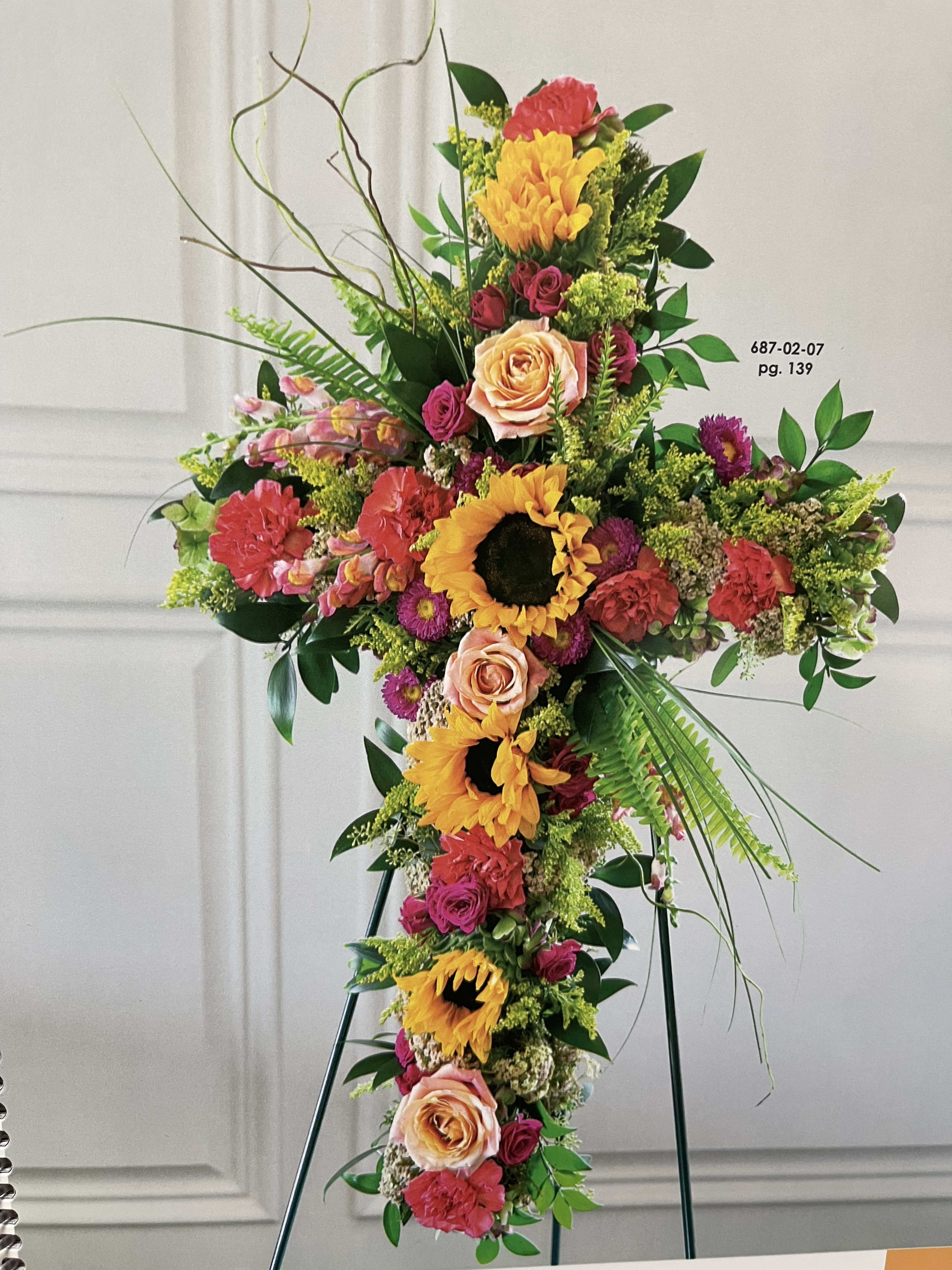 Wildflower Beauty Cross - Beautiful cross made off wild blooms with sunflowers and roses.