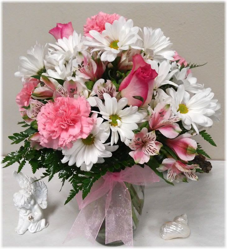Daisies in the Pink - White daisies, roses, carnations and alstromeria fill the ginger jar