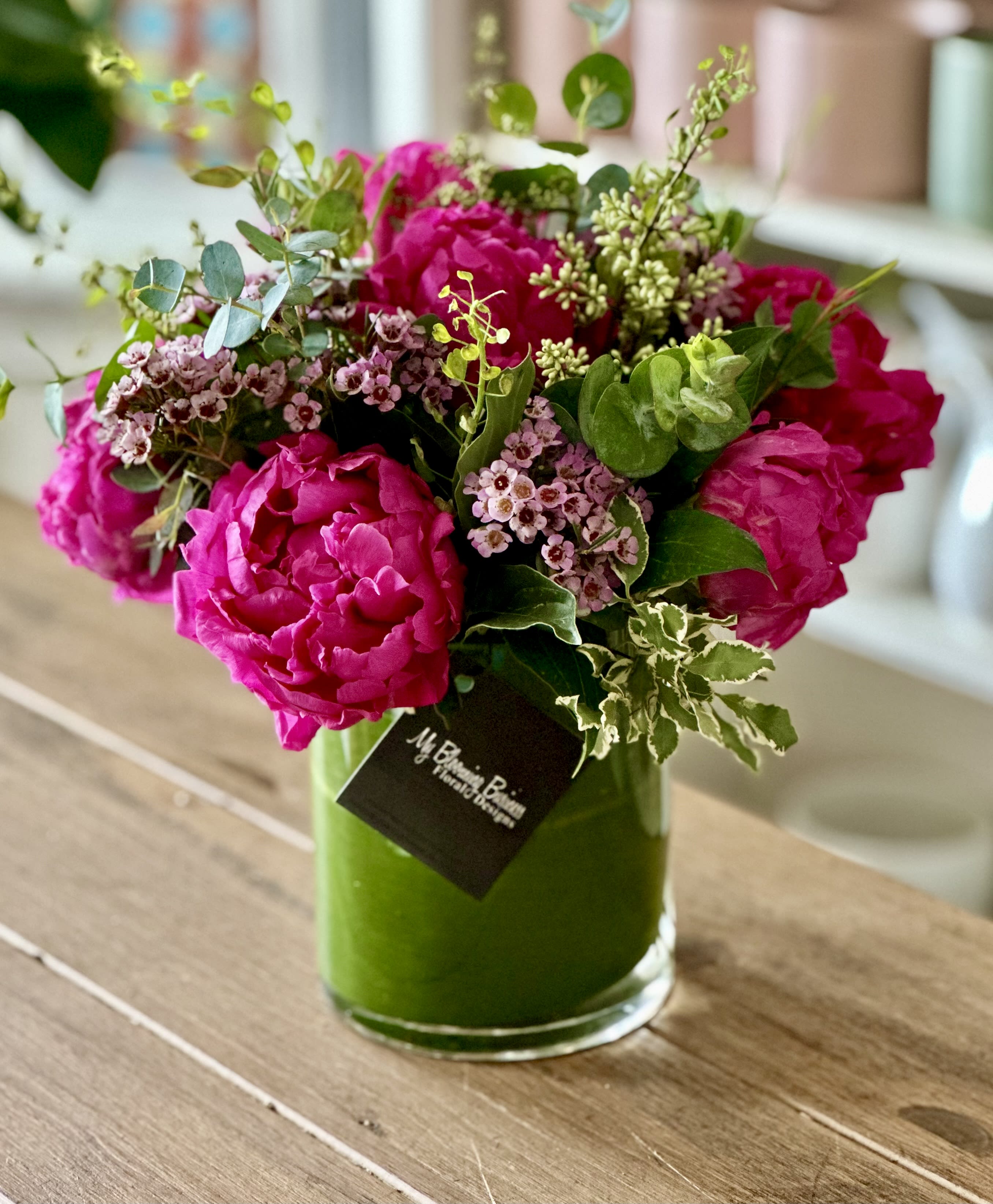 Peonies Please!  - Peonies Please! This beautiful arrangement creates magic in your home with its lush pink peonies and stylishly displayed in a clear cylinder vase. Celebrate the peony season in style and show your blooming personality with this cheerful floral design.   