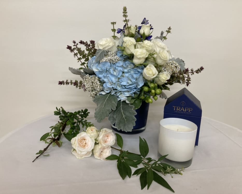 Designer's Choice Arrangement with Trapp Candle - Each set includes a scented Trapp candle and a beautiful bouquet of the designer's choice. The picture is only an example.