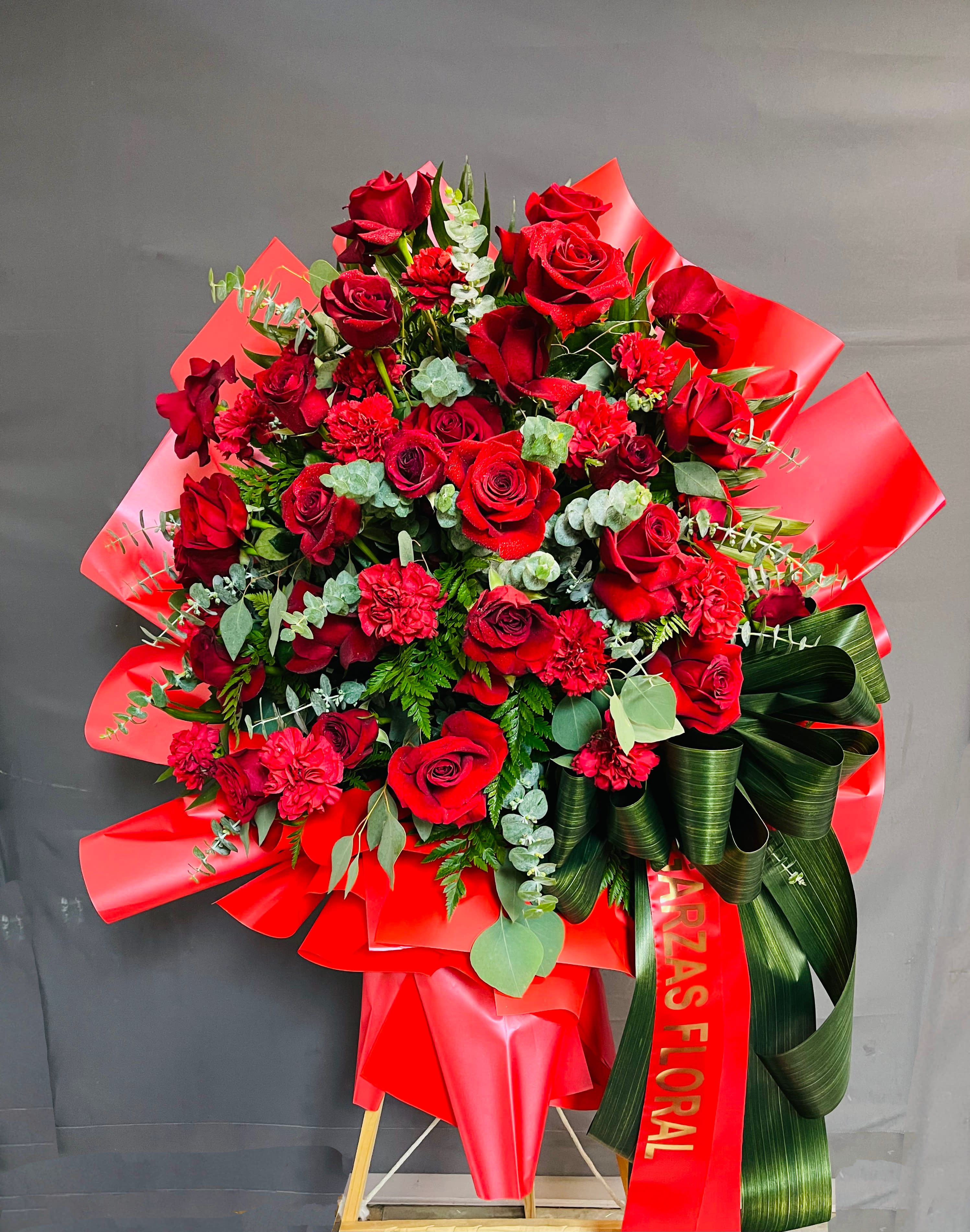 Exquisite Red Easel Exquisite Red Easel - Beautiful and unique floral easel with red roses and carnations with korean paper wrapped around,