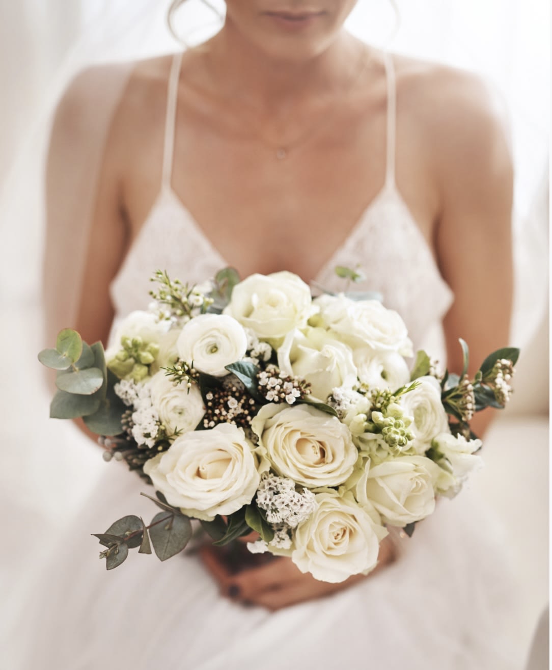 Rose &amp; Ranunculus bouquet  - This elegant hand tied bouquet of roses, Ranunculus accented with greenery and fillers.