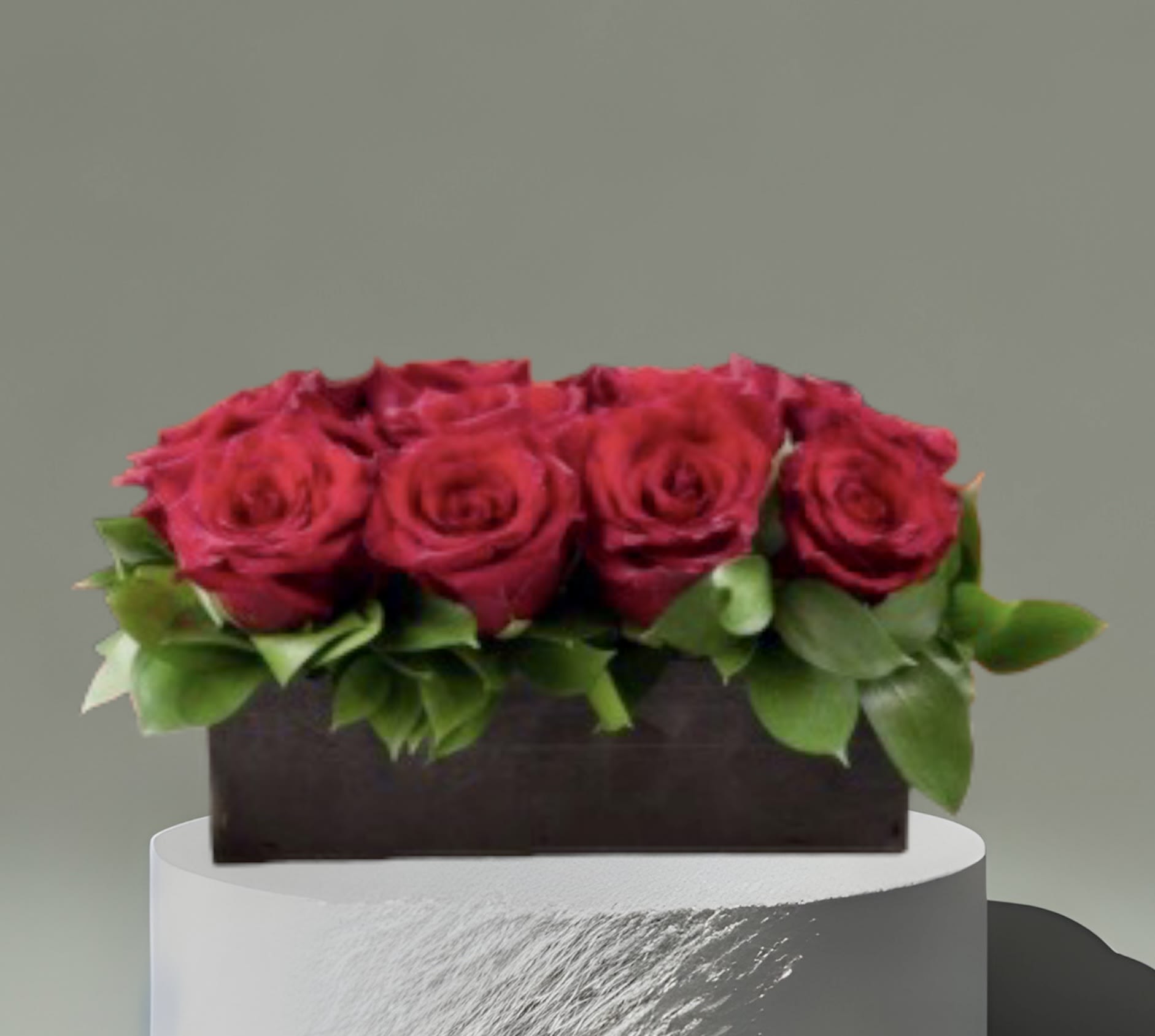 Red Rose Box - Red roses and foliage in a low wooden box. Standard- 1 dozen, Deluxe- 2 dozen, Premium- 3 dozen.