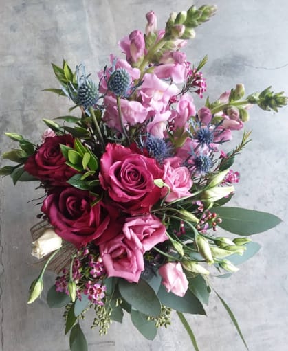 Thistle And Rose - A bouquet filled with drama, sure to make a statement in any setting. 
