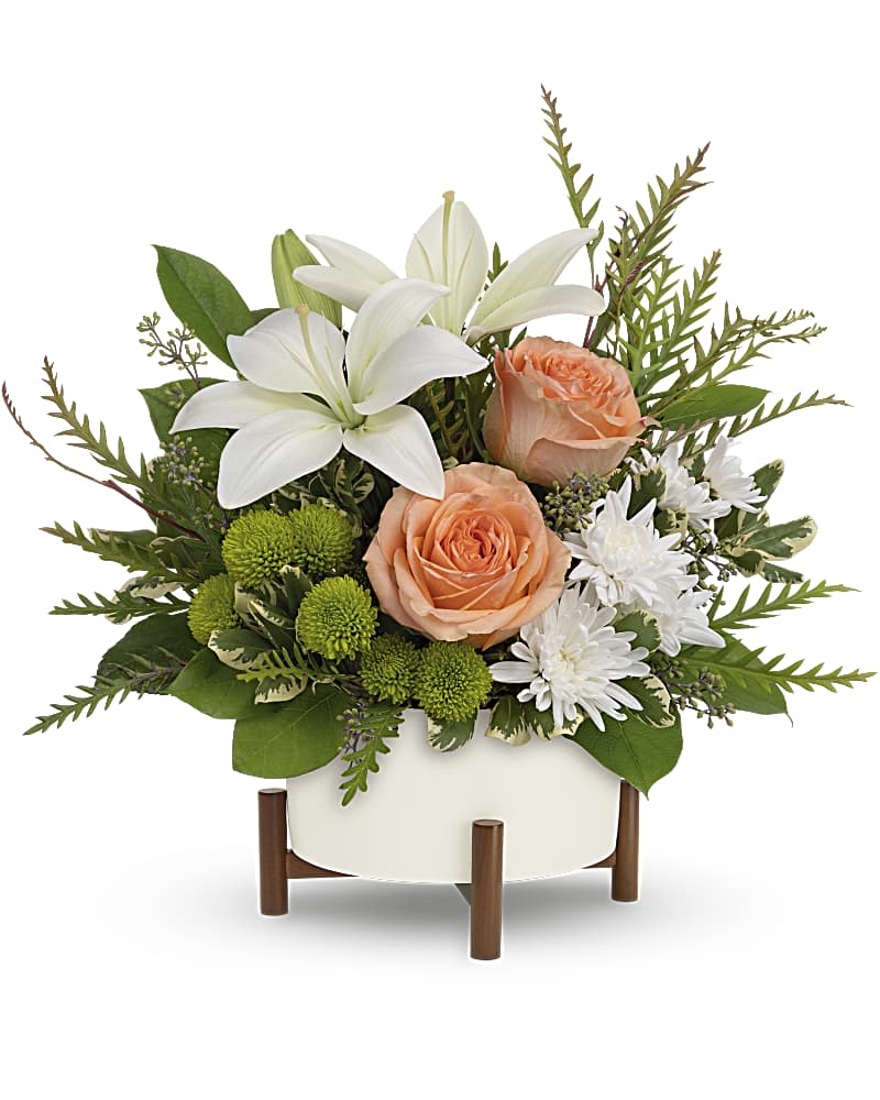 Mod Blooms Bouquet - Unique in every way, this striking bouquet of peach roses and white lilies is artfully presented in a mid-mod ceramic planter with sculptural wood base.