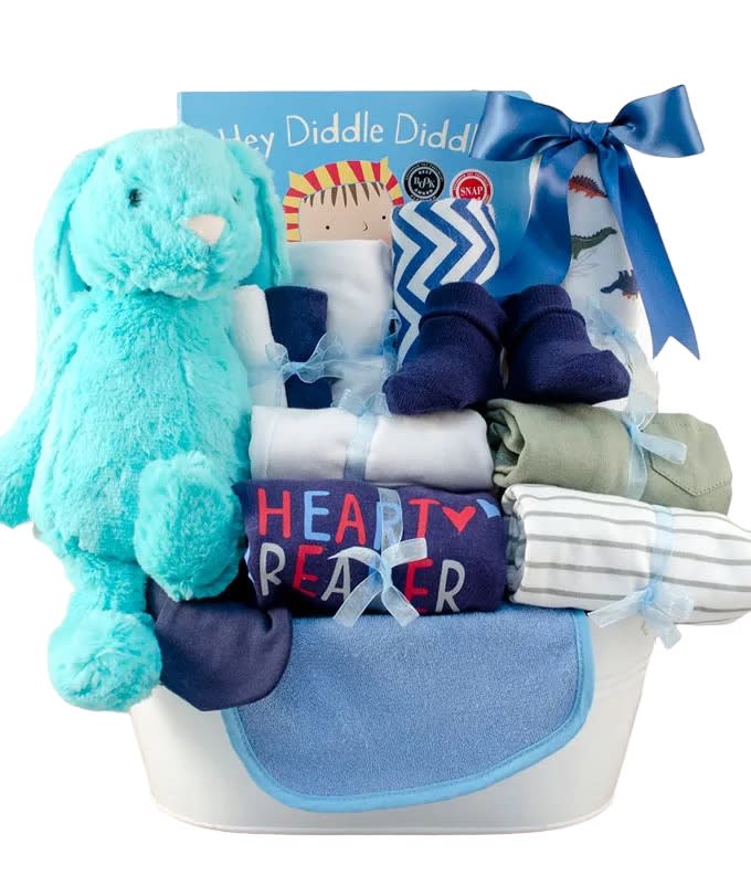 Bringing Home Baby Gift Basket Bringing Home Baby Gift Basket - Everything the new parents need for the bundle of joy is wrapped up in this adorable gift basket! The perfect gift comes with onesies, socks, a cap, mittens, washcloths, toys, a book, and more! Treat them to an assortment of goodies they're sure to love as they welcome their newborn home.