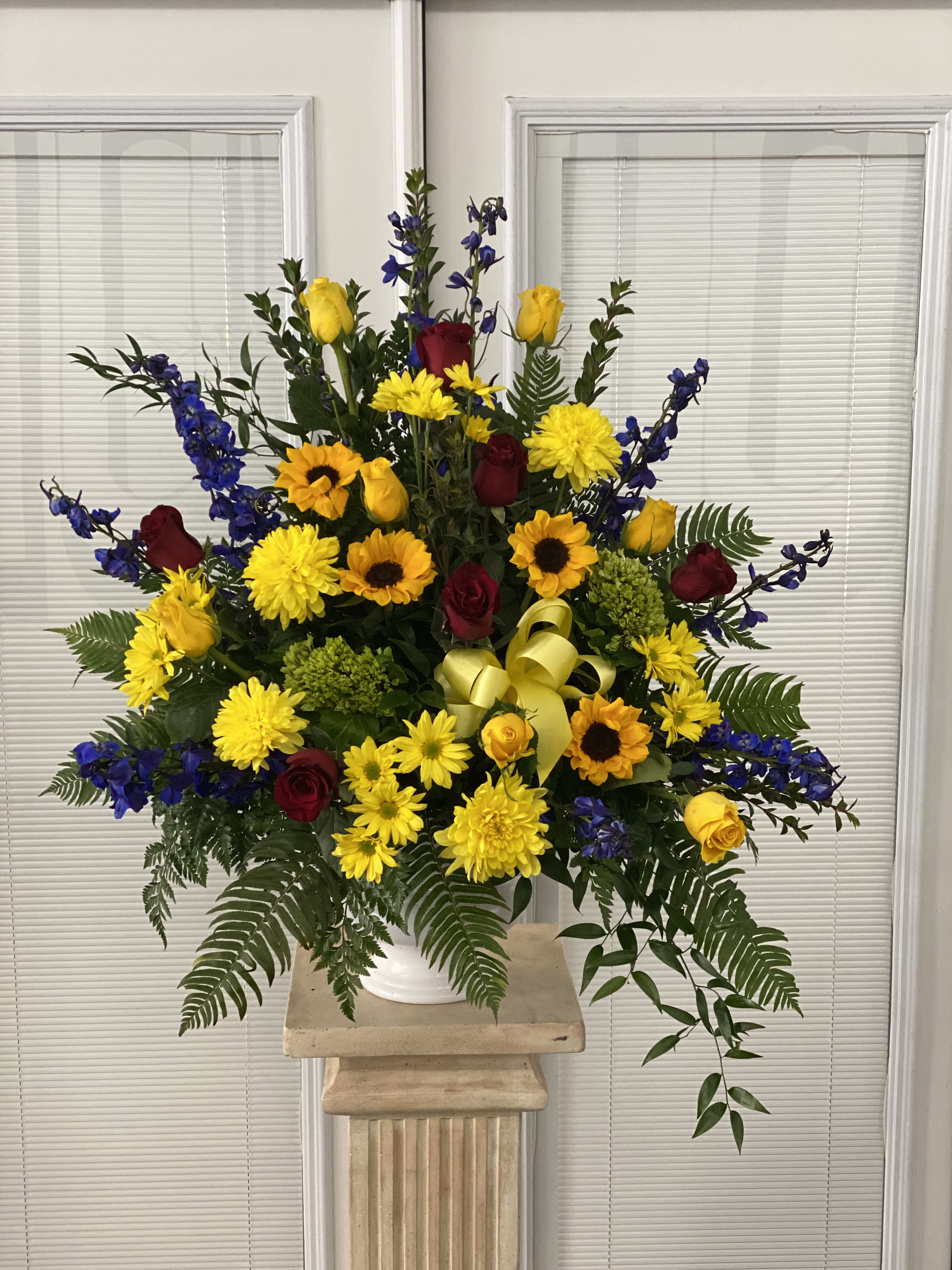 Love Lives On Floor Mache - Bursting with joy this radiant floor mache of rainbow blooms is an exuberant tribute to never-ending love