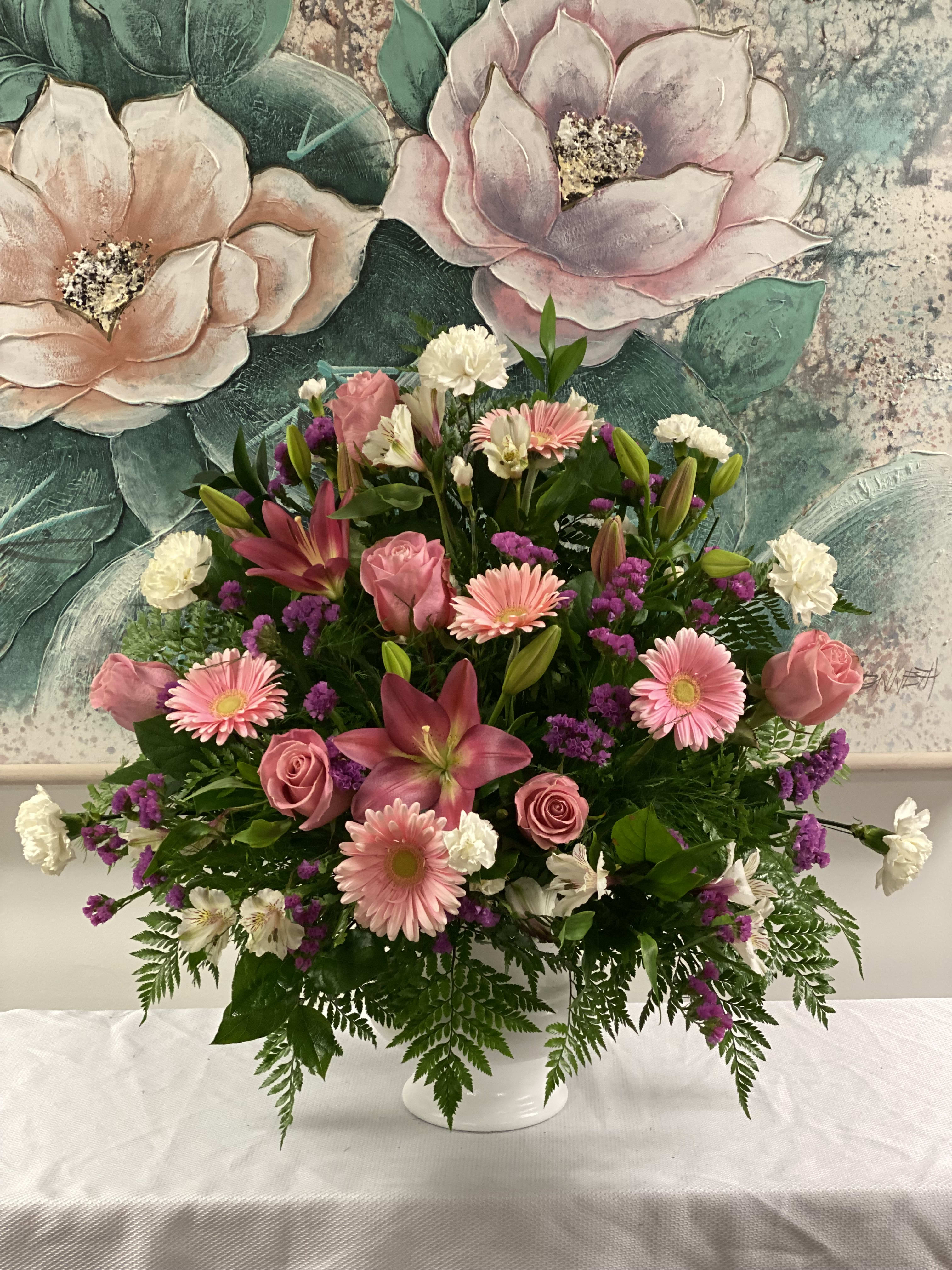Pretty Pinks Floor Mache Pretty Pinks Floor Mache - When words aren't enough to convey all you feel at this difficult time, let our beautiful floor mache help you express your feelings perfectly. With pink flowers to symbolize admiration and appreciation for a life well lived this gathering of pink flowers brings beauty and hope to a difficult time.