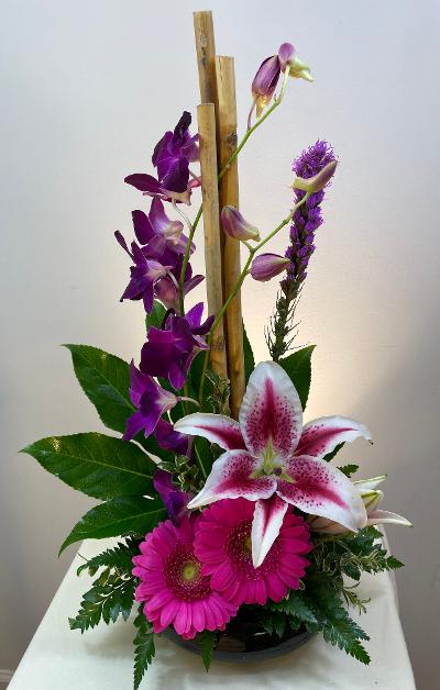 Asiatic Flair Asiatic Flair - Dendrobium orchids with river cane aid lilies create a dramatic impression!