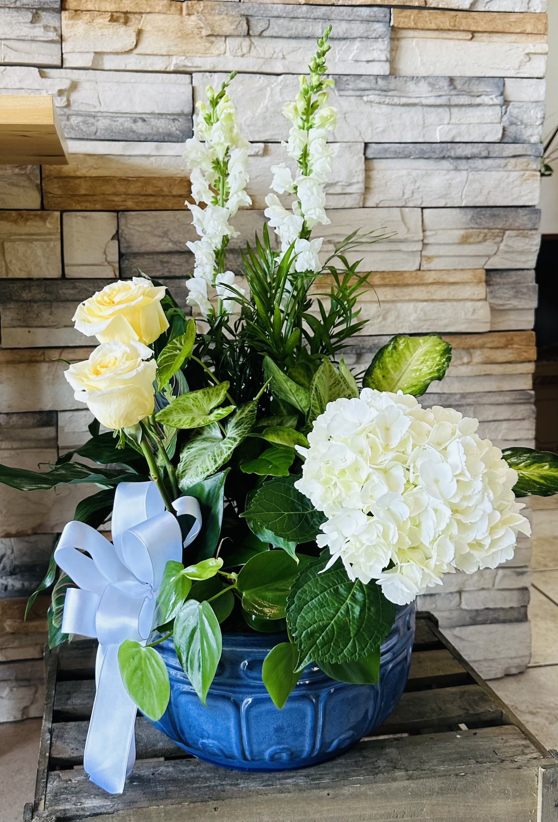 Luxurious Dish Garden with added flowers. - Large dish garden containing seven different green plants arranged in a beautiful 12&quot; inches ceramic container (color of container depending on availability). Fresh cut flowers added to enhance the presentation.  We will used water tubes so any kind of flowers can be used. Please contact us or make a note if you have a preference in flowers or colors.
