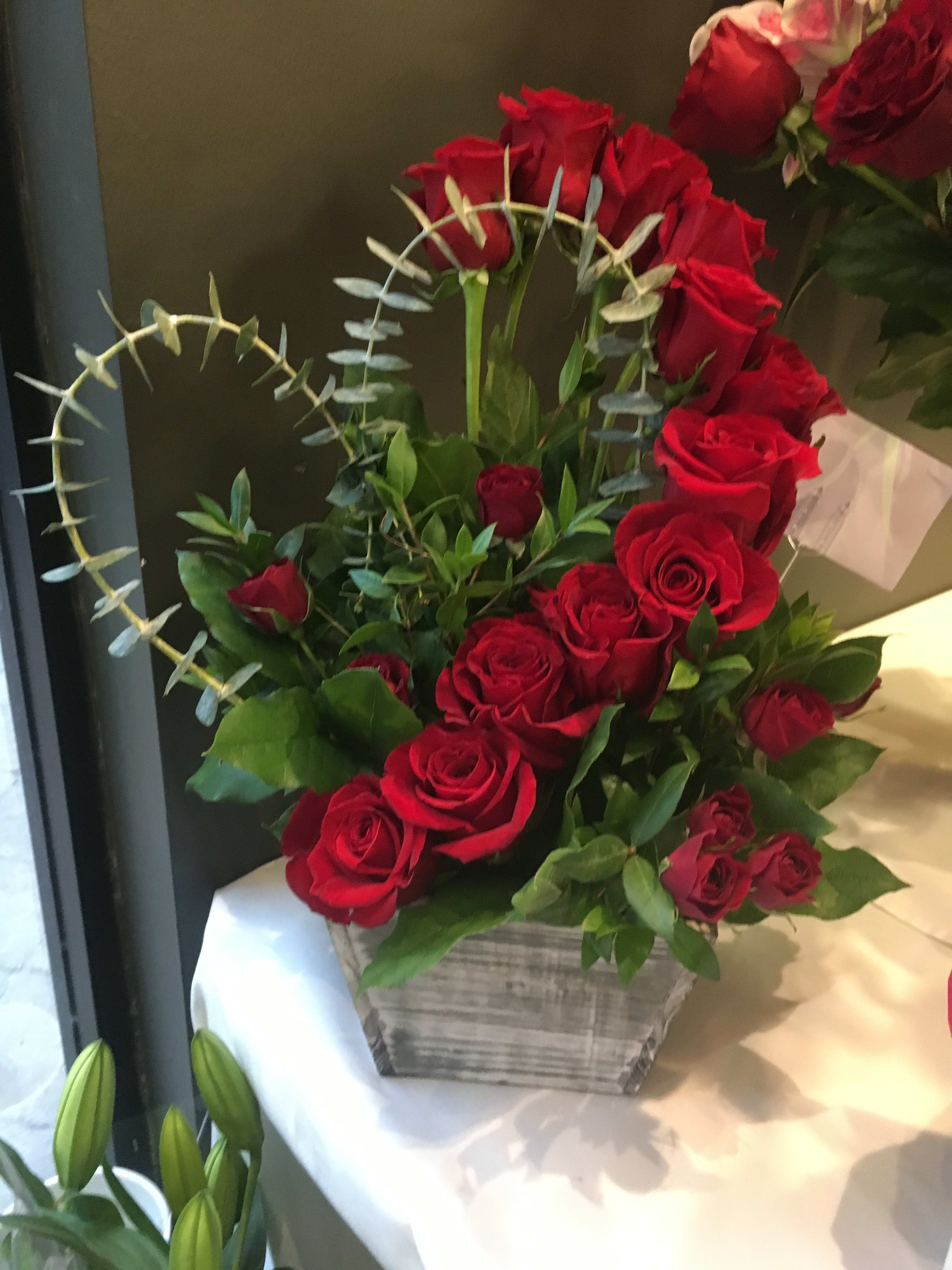Heart Full of Roses Heart Full of Roses - 1 Dozen roses cleverly designed in the shape of a heart with Eucalyptus