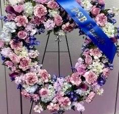 Standing Pink, White & Purple Heart Wreath Standing Pink, White & Purple Heart Wreath - This standing heart shaped wreath features gentle colors of pinks & purples, a simple item of heart shaped remembrance. Banner sold at an additional cost.