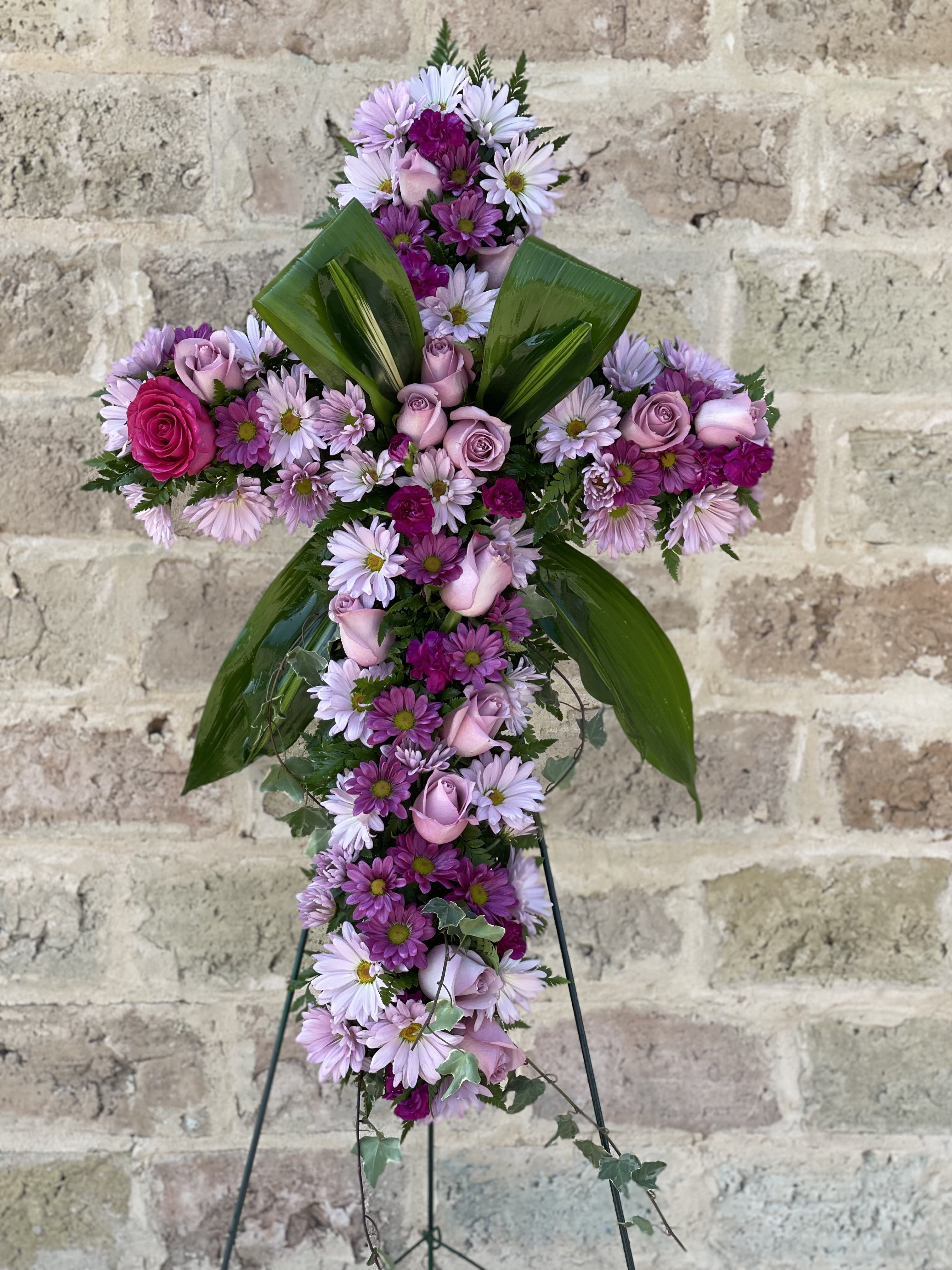 Finest Farewell Sympathy Cross - Praise your loved one with a floral cross that truly represents their devotion to their friends, family, and community. The Finest Farewell Sympathy Cross brings radiant beauty and cherished comfort to those who are mourning. This floral cross is a peaceful and reassuring addition to any funeral service, memorial service, or wake.