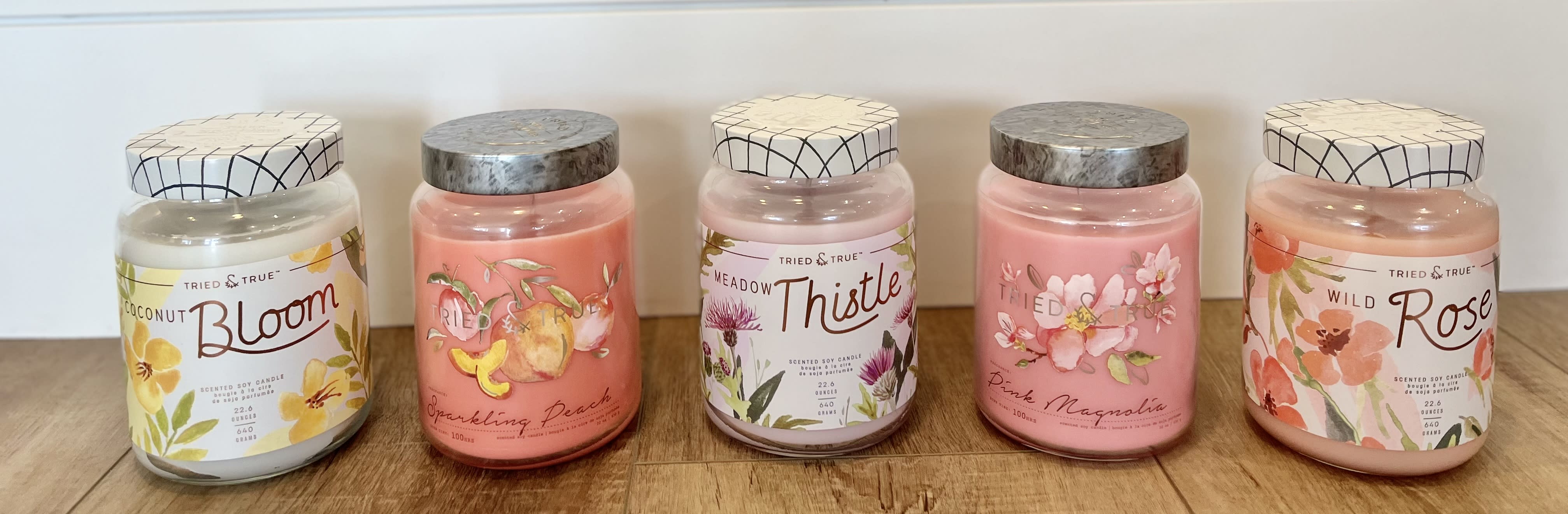 Illume Candle 22 OZ - We love these candles! You can't go wrong with either candle. They all smell AMAZING. Candle Scent options - Meadow Thistle  Wild Rose Sparkling Peach  Pink Magnolia  Coconut Bloom