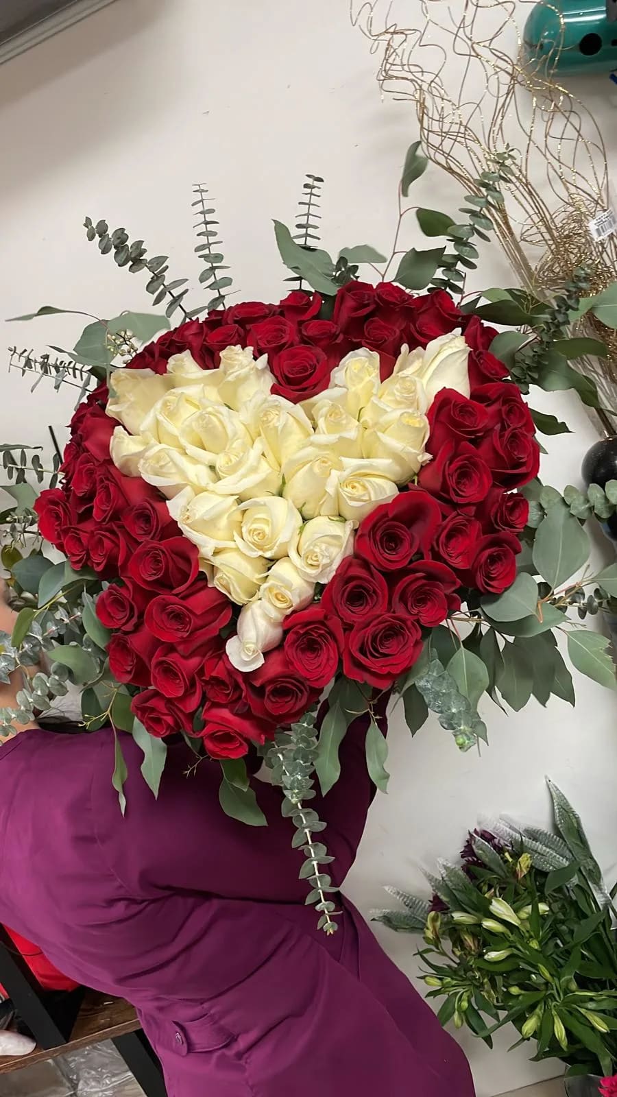 Heart of love Bouquet  Heart of love Bouquet  - 3 dozen red roses and 2 doz white roses shaped as a heart. Bouquet style