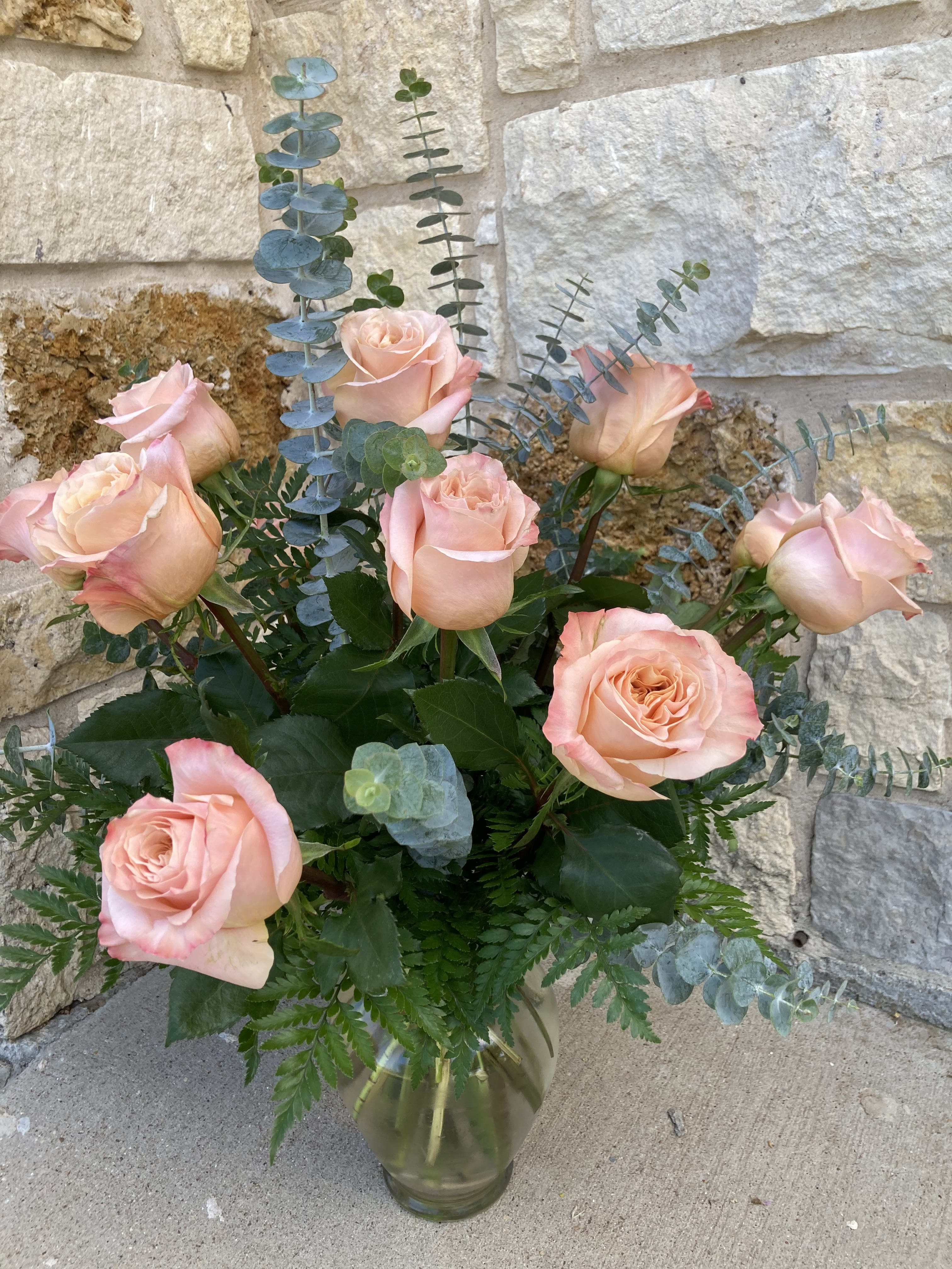 Tickle Me Peach - A dozen peach roses laugh among the eucalyptus and green leatherleaf