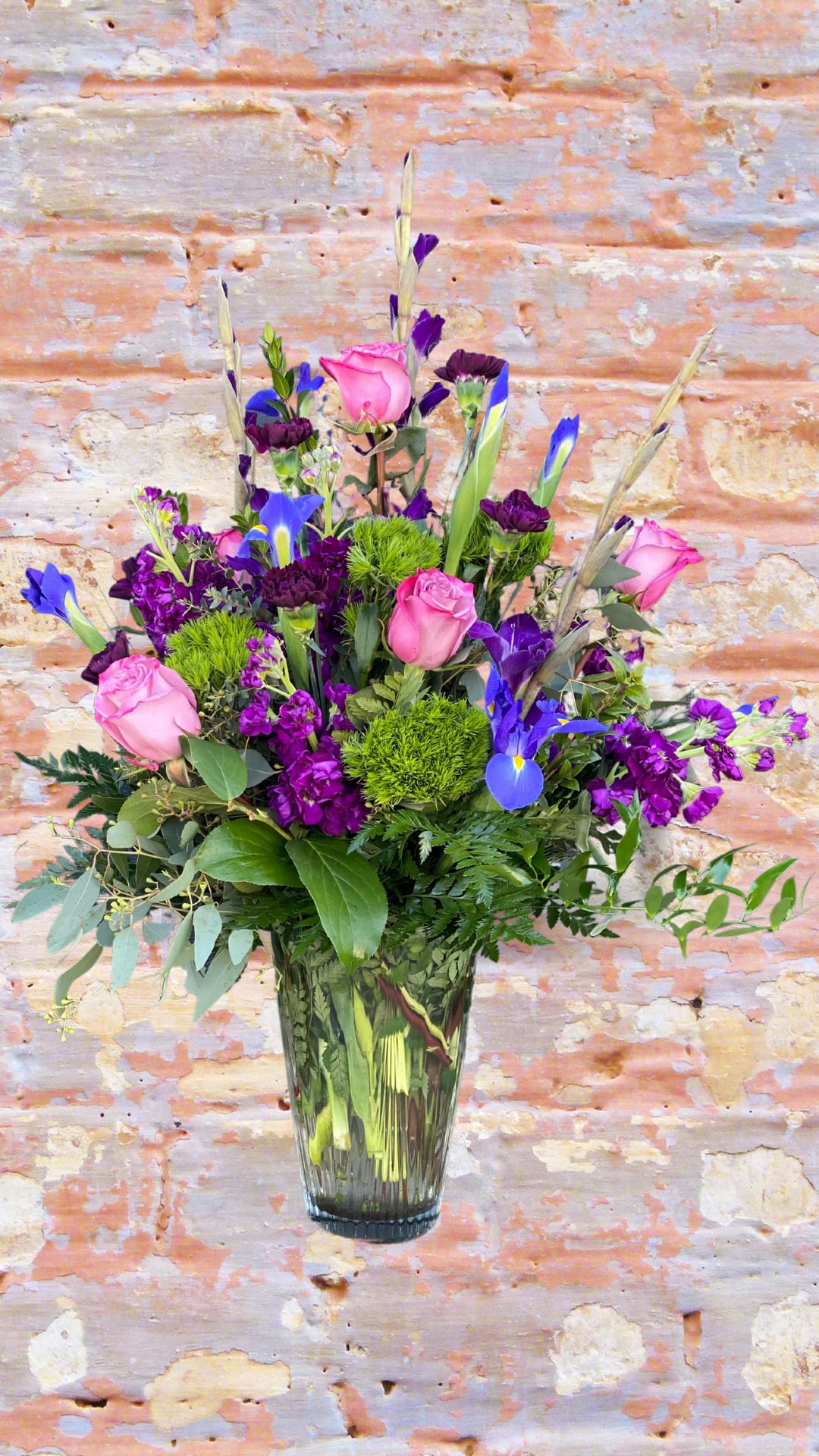 Violet Dreamer - For the purple loving person of your life. Take their breath away with an assortment of all things purple with a small play on lime green to really bring out the brightness of this piece. 