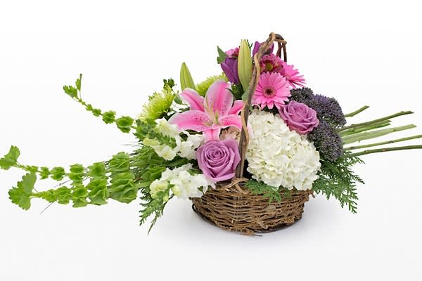 Sympathy Basket- Garden Delight - grapevine and twig vine basket with hydrangea, roses, lilies, bells of ireland etc....Delivered to Wiley Funeral Home , Martins Funeral Home for service