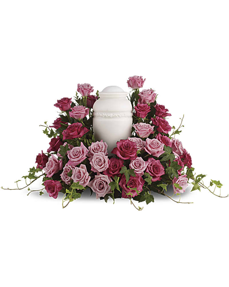 Bed Of Pink Roses - Surrounded by roses, enveloped in love - a sumptuous pink rose wreath of light and dark hues serves as a stunning memorial.  *Please notify florist with urn dimensions.