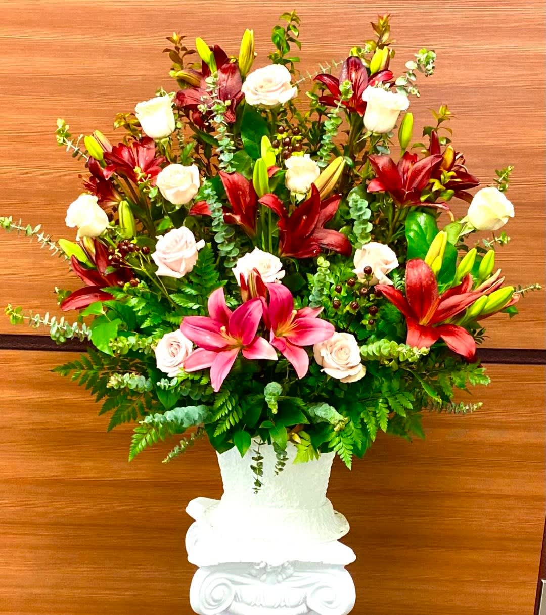 Marsala floor basket Marsala floor basket - This beautiful basket is filled with Burgundy Asiatic lilies, Quicksand Roses, Burgundy Coffee Bean, and various types of luscious foliage. This design measures approx. 24"W x 28"H.