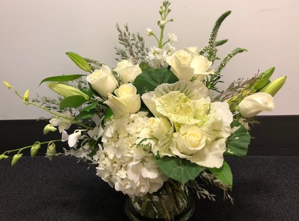 It's classic - White flowers are always stylish. They are elegant and distinctive. White works for any occasion and is a guaranteed pleaser.  We at Red Bud Florals can create designs that are simply elegant or extravagant, depending on your request.