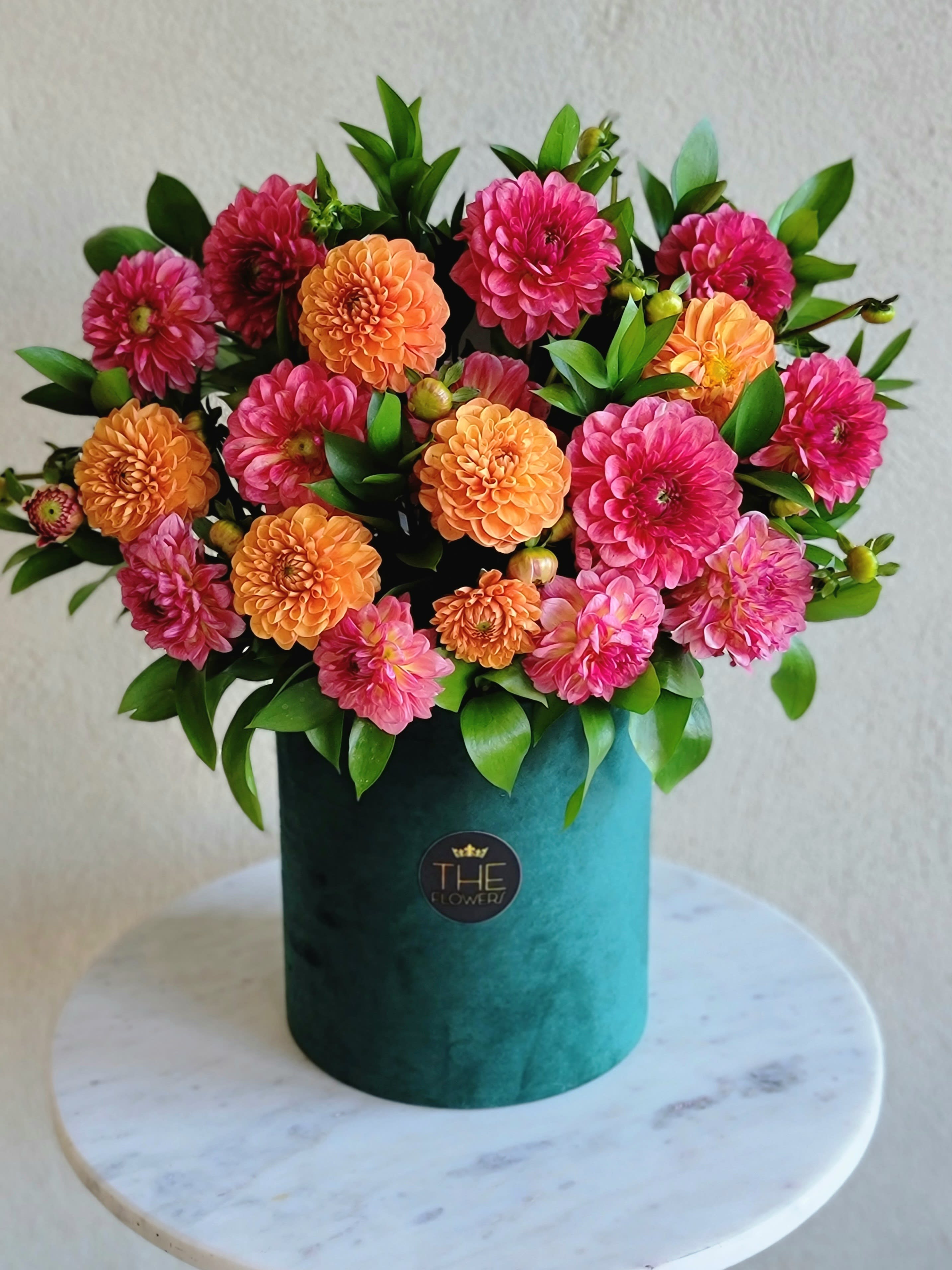 Charming Summer  - The composition made up of dahlias will definitely appeal to connoisseurs of beauty. According to an ancient legend, this flower grew out of a small piece of a star that fell to earth. Soft balloon flowers with needle-like petals are able to compete with roses in their beauty. They symbolize loyalty, love, modesty.